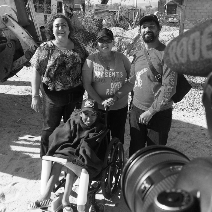 Juan (on the right) with his wife (on wheelchair) posing happily for the press cameras.